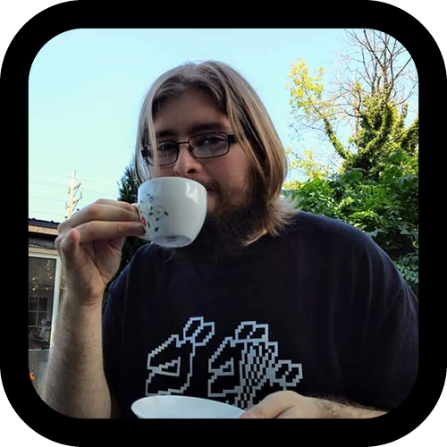 A photo of DurchBurch goofily drinking water from a tea cup while wearing a Stand Lasagna shirt from Clothing Unrelated.